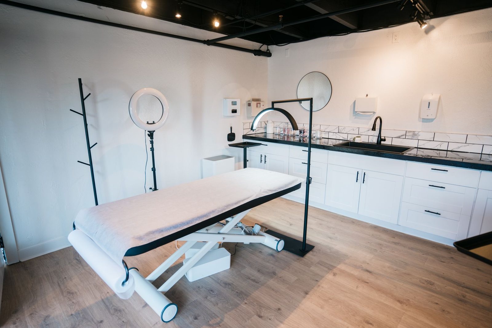 An empty treatment room in a modern aesthetic clinic.