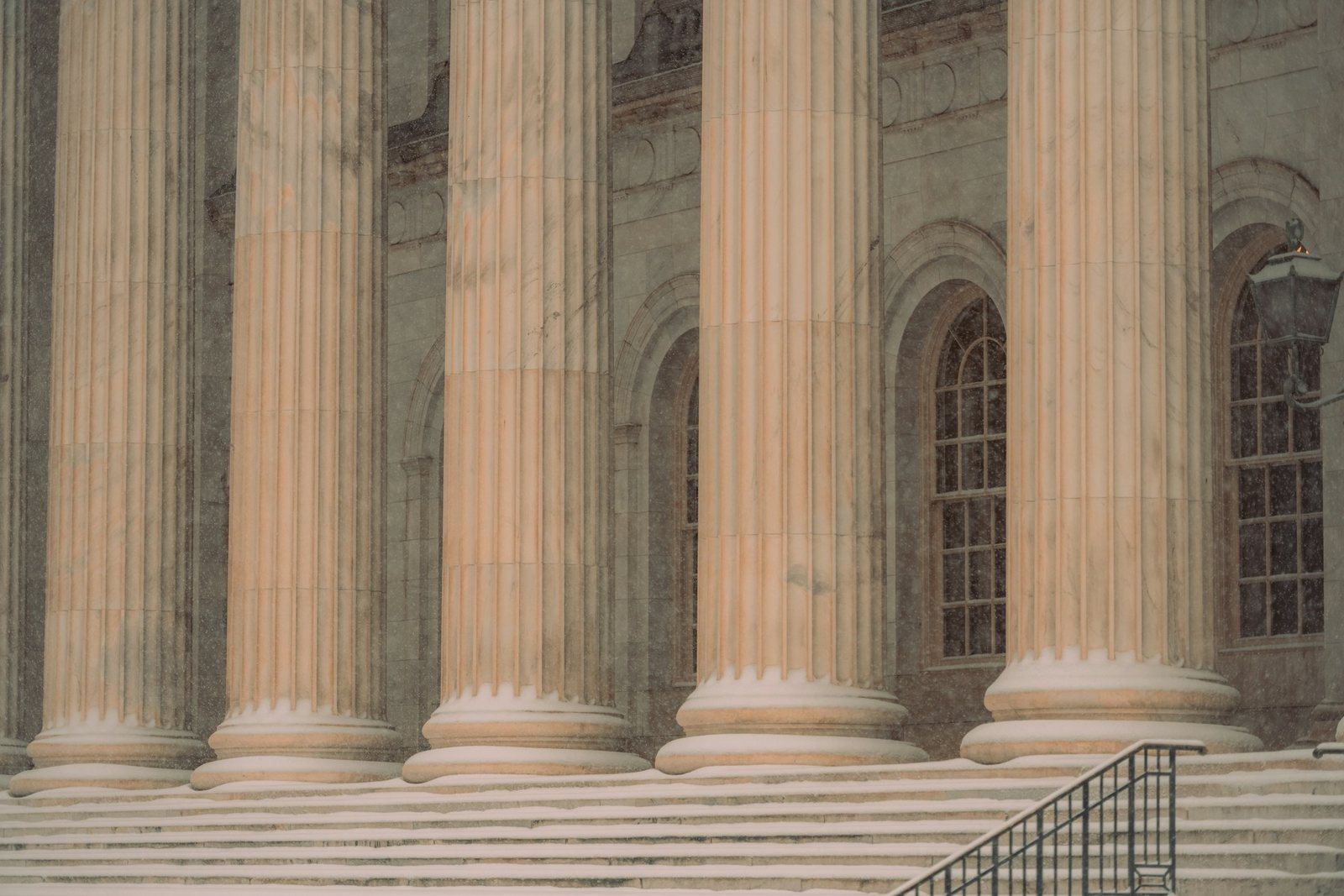 The stone columns of a courthouse entrance.