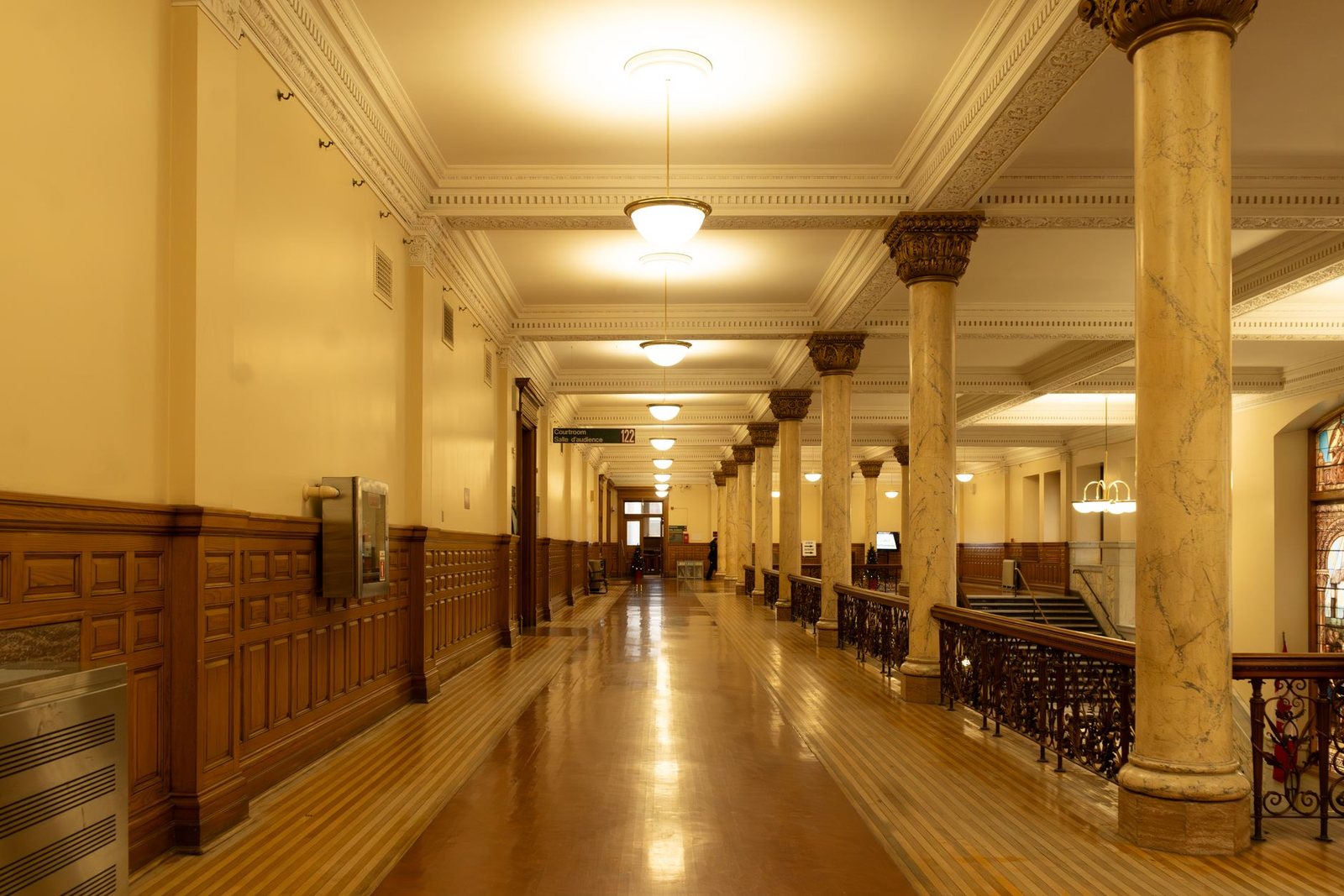 The panelled corridor of a county courthouse.