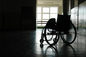 Silhouette of a lone wheelchair