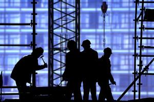Silhouettes of men working in construction